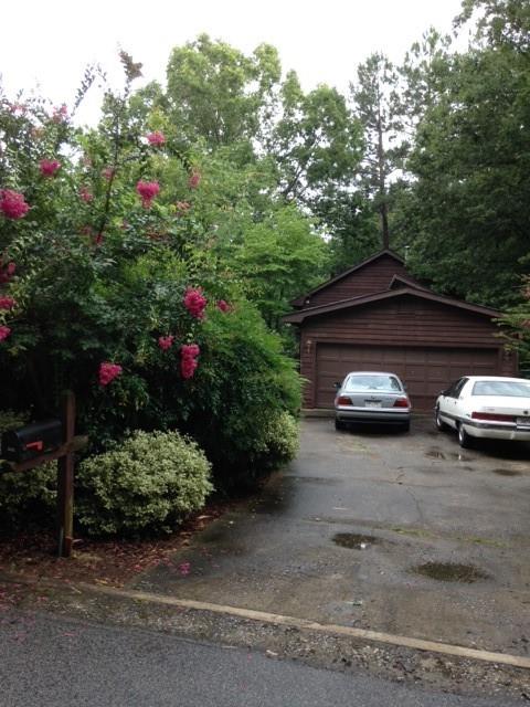 3315 Canterbury Trail Rex, GA 30273 - Photo 16 of 22 a front view of a house with a yard and garage
