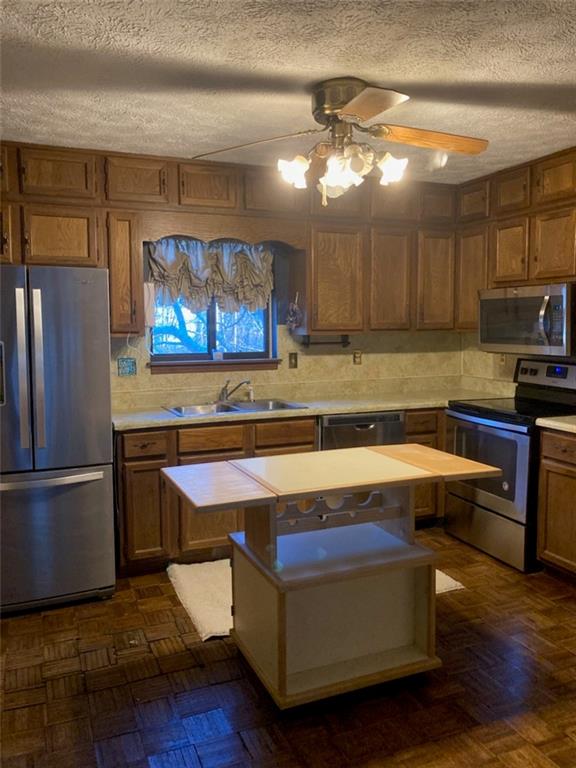 3315 Canterbury Trail Rex, GA 30273 - Photo 2 of 22 a kitchen with kitchen island a sink appliances and cabinets