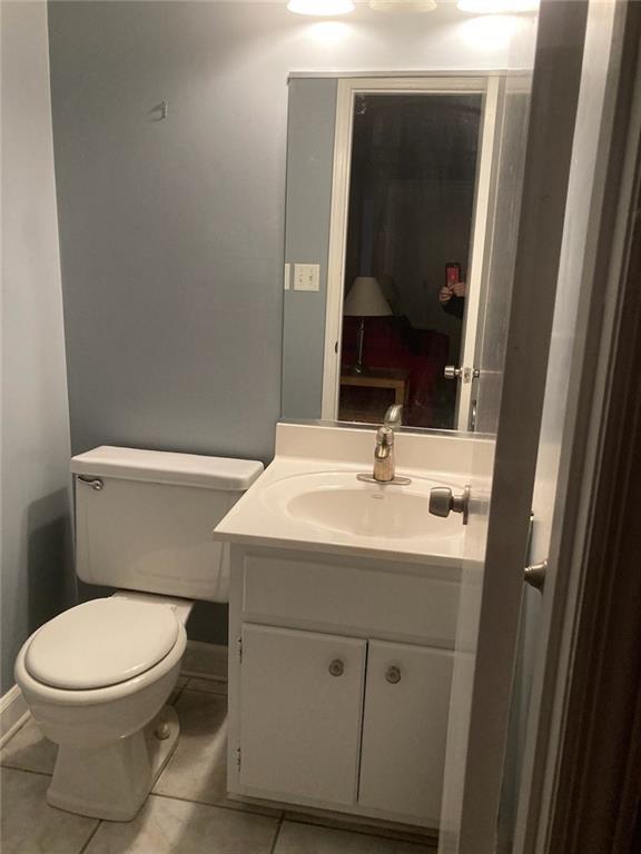 3315 Canterbury Trail Rex, GA 30273 - Photo 5 of 22 a bathroom with a sink a toilet and mirror