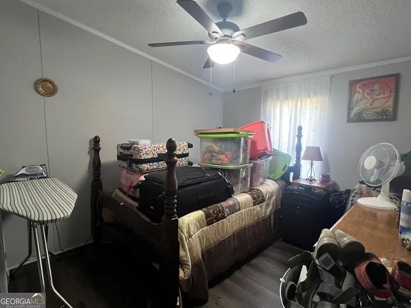 a living room with furniture a rug and a window