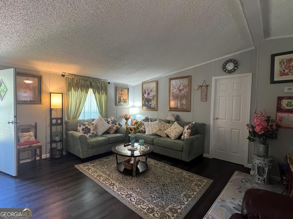 166 Pebble Hills Road Cochran, GA 31014 - Photo 3 of 21 a living room with furniture and wooden floor
