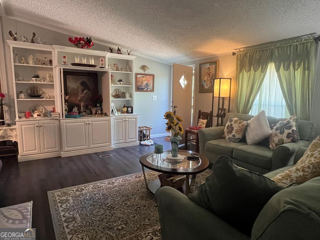 166 Pebble Hills Road Cochran, GA 31014 - Photo 4 of 21 a living room with furniture and wooden floor