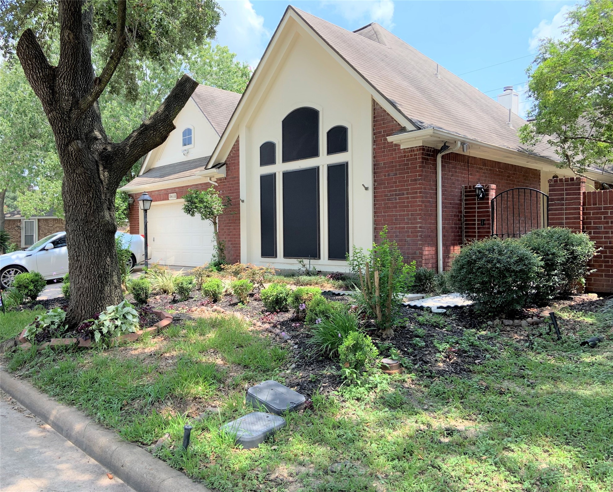 8418 Westnut Lane Houston, TX 77040 - Photo 13 of 13 a front view of a house with garden