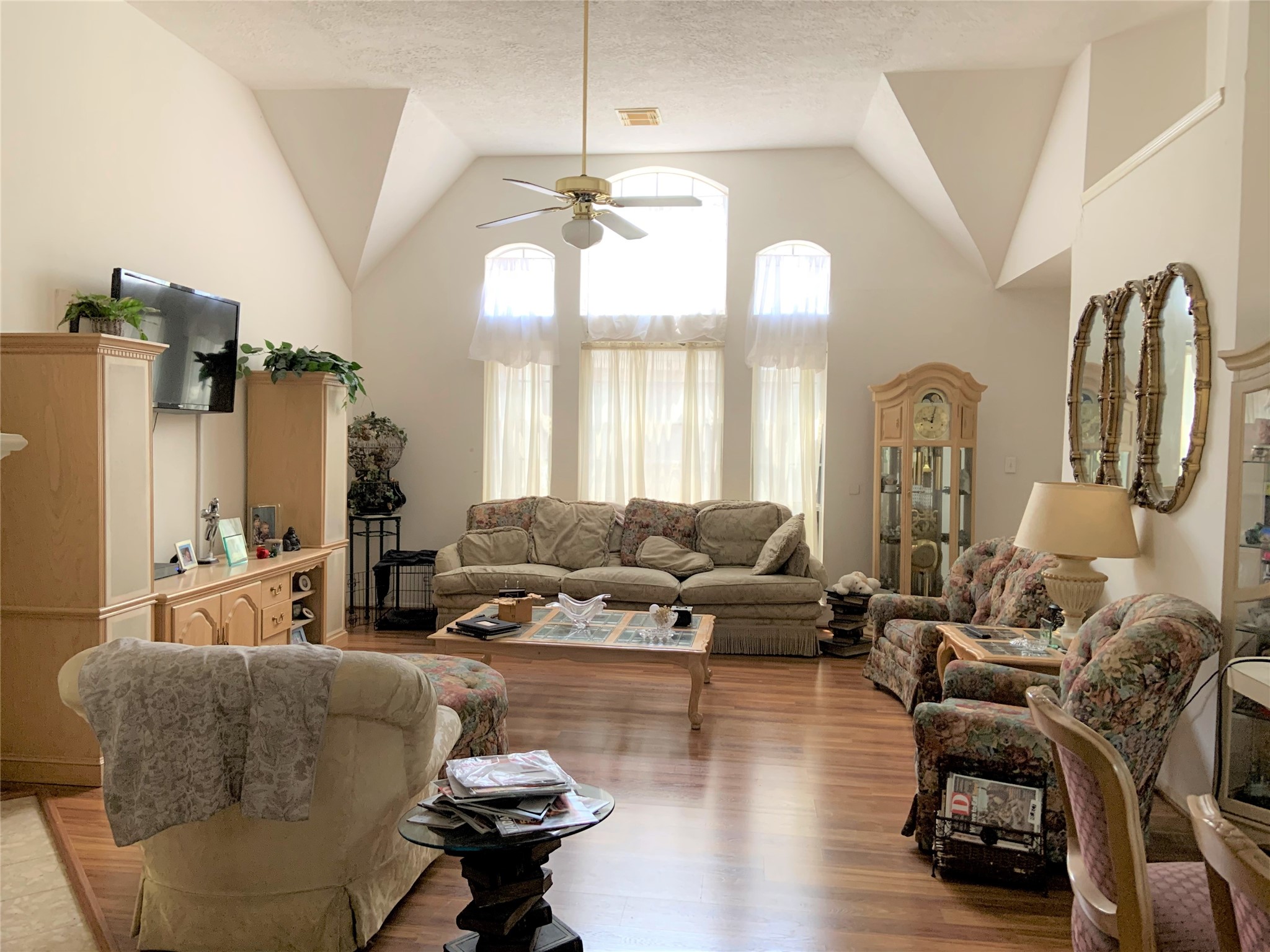 8418 Westnut Lane Houston, TX 77040 - Photo 3 of 13 a living room with fireplace furniture and a chandelier