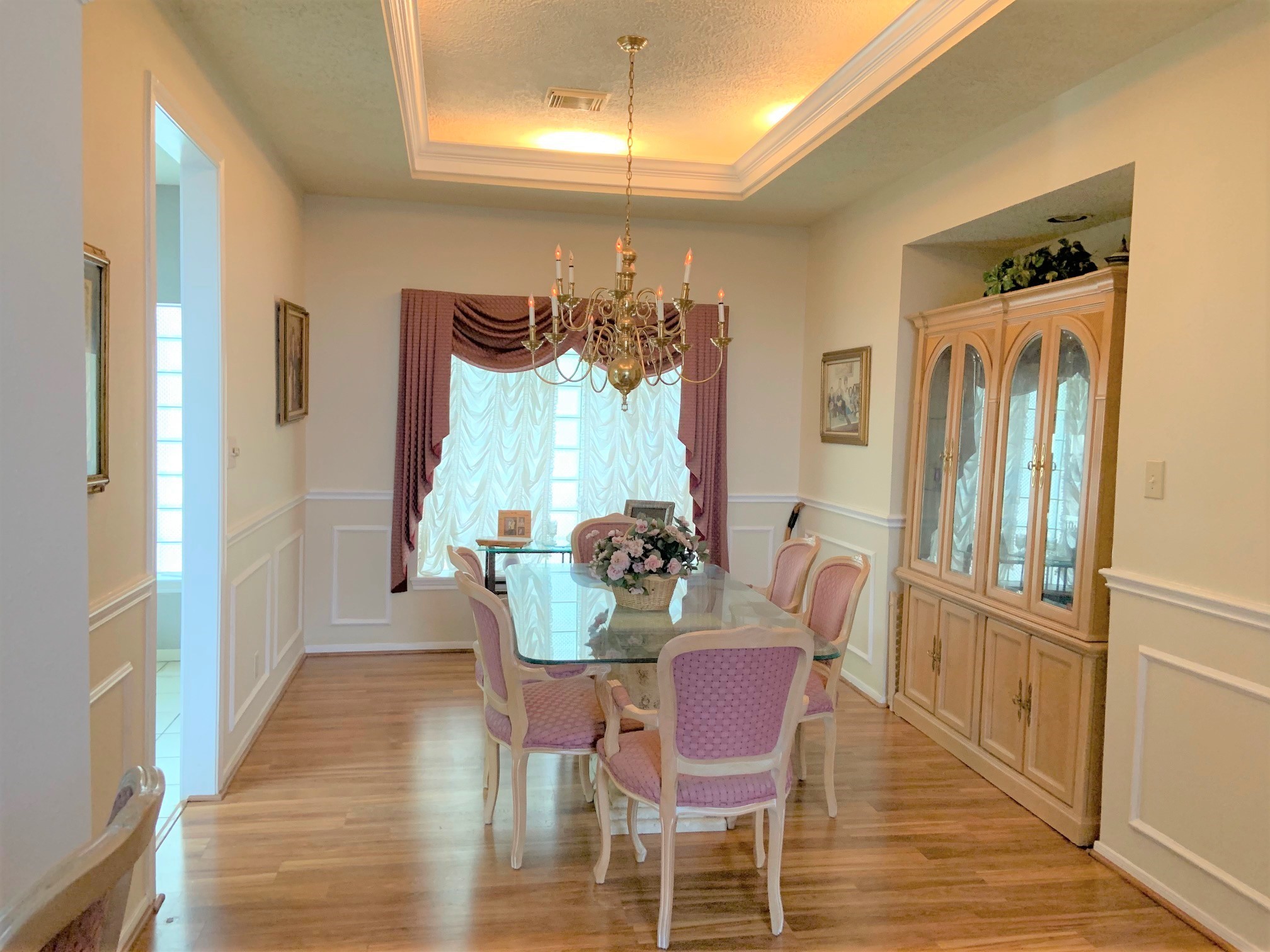 8418 Westnut Lane Houston, TX 77040 - Photo 5 of 13 a dining room with furniture a chandelier and wooden floor
