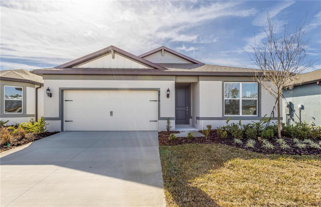 4416 Southwest 84th St Road Ocala, FL 34476 - Photo 1 of 1 a front view of a house with garden