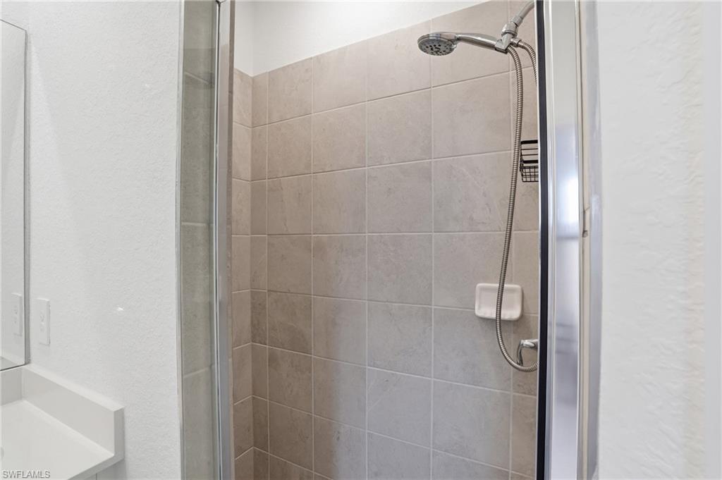2215 Dragonfruit Way Naples, FL 34120 - Photo 25 of 38 a bathroom with a shower