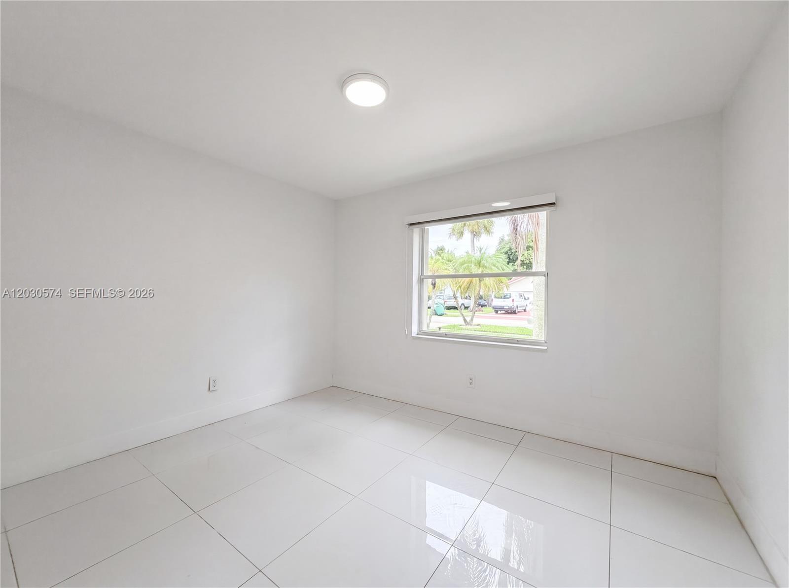 16571 Southwest 145th Avenue Miami, FL 33177 - Photo 19 of 25 an empty room with windows