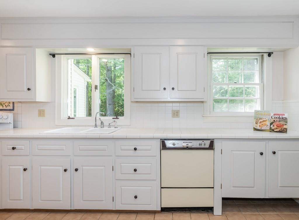 126 Brickyard Road Southampton, MA 01073 - Photo 17 of 41 a kitchen with granite countertop white cabinets and white appliances