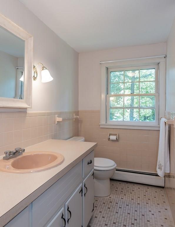 126 Brickyard Road Southampton, MA 01073 - Photo 30 of 41 a bathroom with a sink toilet a mirror and window