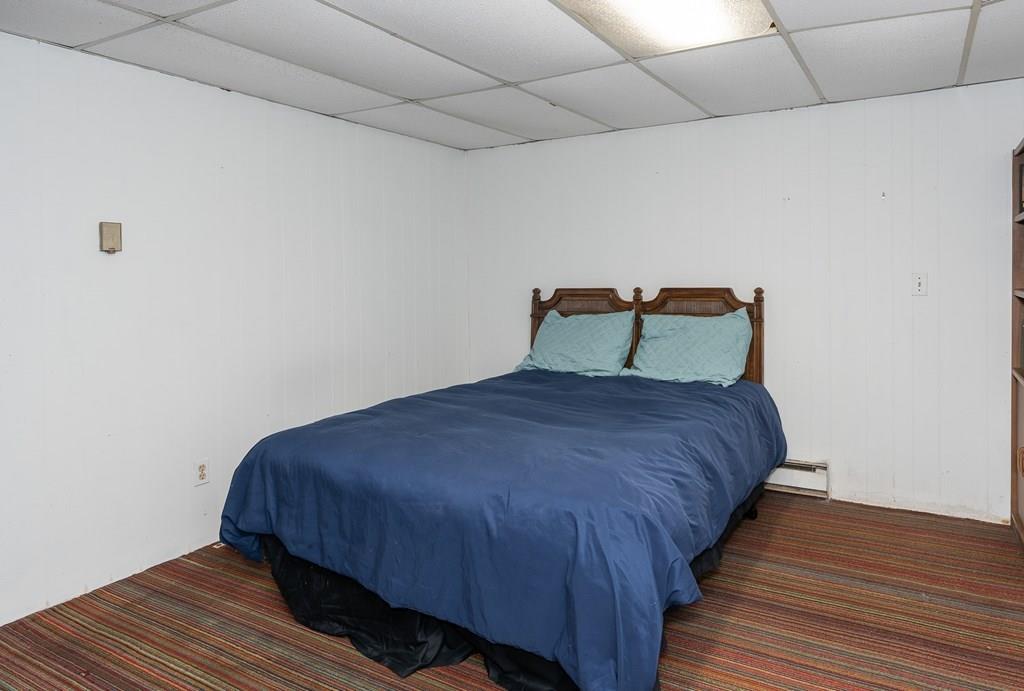 126 Brickyard Road Southampton, MA 01073 - Photo 35 of 41 a bedroom with a bed and wooden floor