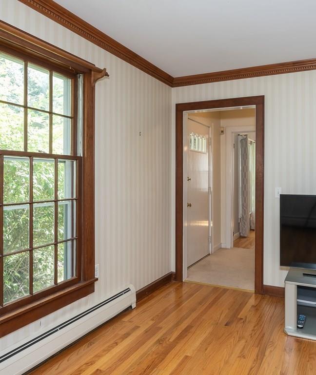 126 Brickyard Road Southampton, MA 01073 - Photo 6 of 41 a view of a livingroom with wooden floor and a flat screen tv
