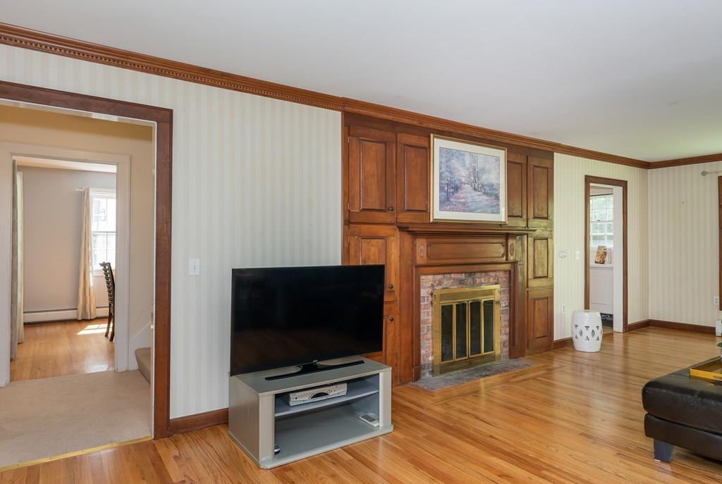 126 Brickyard Road Southampton, MA 01073 - Photo 7 of 41 a living room with fireplace furniture and a flat screen tv