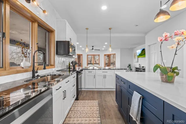 a kitchen with a sink stove and cabinets