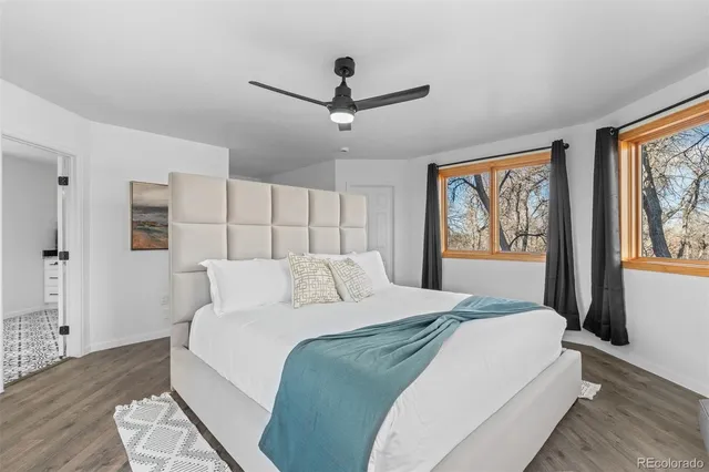 a bedroom with a large bed and a window