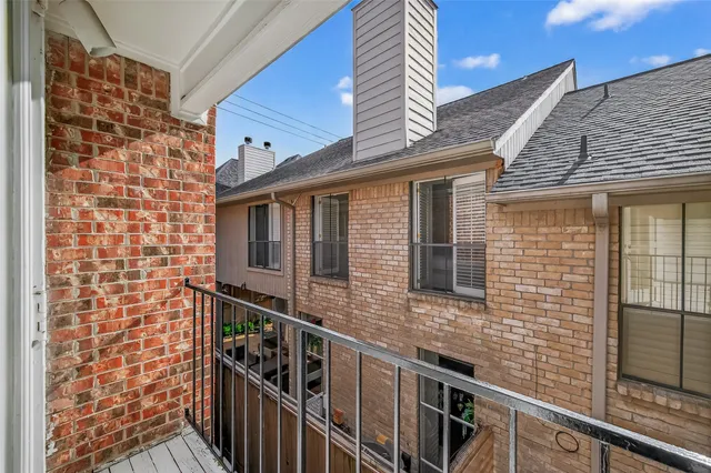 a view of a balcony with furniture