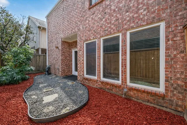 front view of a house with a view of a brick house