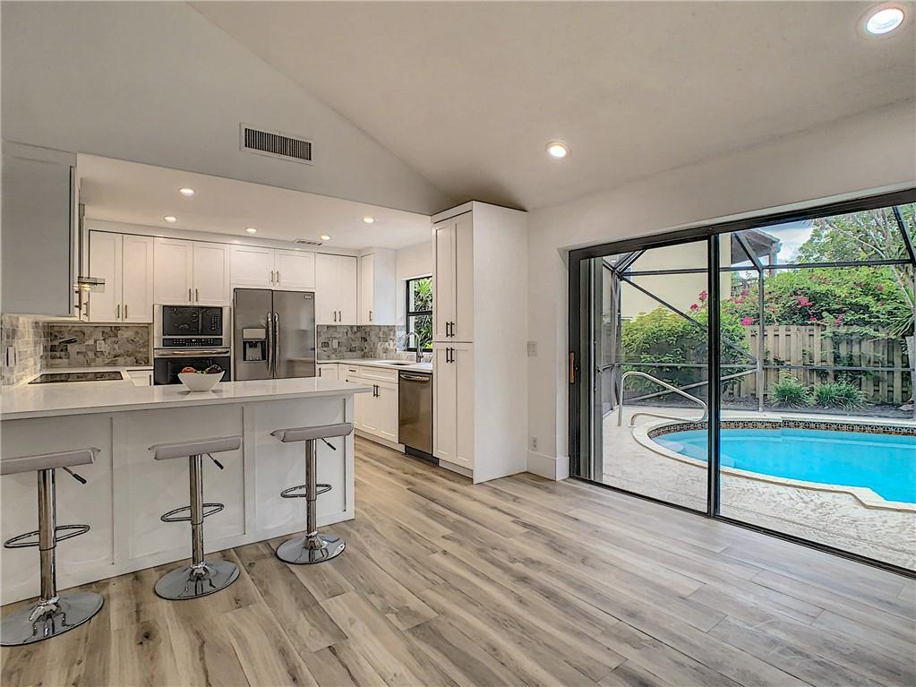4133 Northwest 28th Way Boca Raton, FL 33434 - Photo 2 of 12 Beautiful New Custom Kitchen-Quartz Counters-Marble Backsplash Overlooking Pool