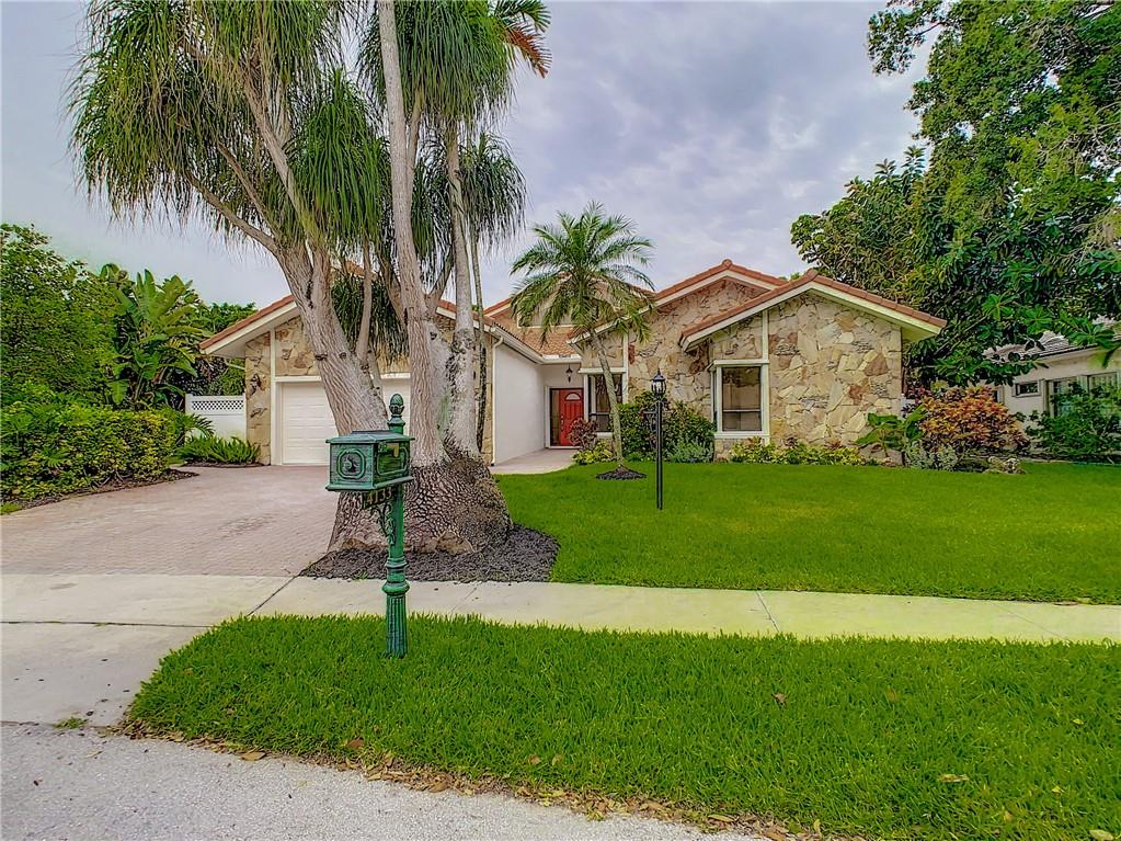 4133 Northwest 28th Way Boca Raton, FL 33434 - Photo 12 of 12 Front of Home with New Landscaping - Freshly Painted