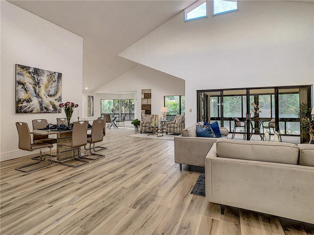 4133 Northwest 28th Way Boca Raton, FL 33434 - Photo 3 of 12 NEW DESIGN--Open Concept Living Room-Dining Room-Vaulted Ceiling
