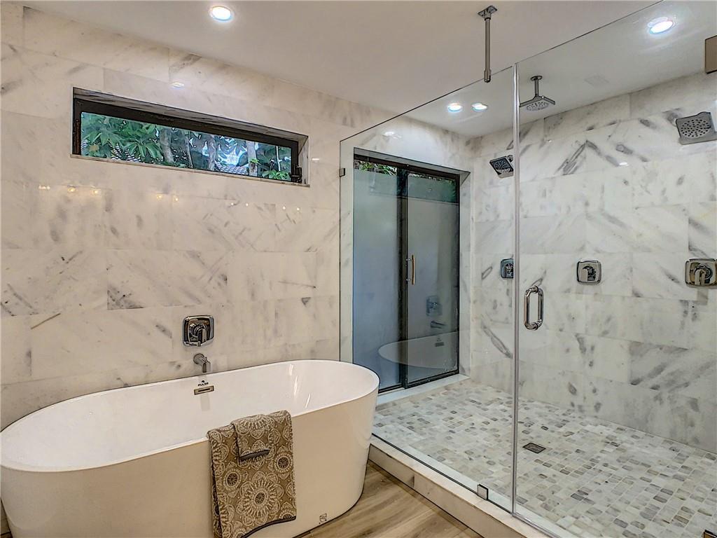 4133 Northwest 28th Way Boca Raton, FL 33434 - Photo 6 of 12 Gorgeous New Marble Master Bath-Soaking Tub-Rainfall Shower