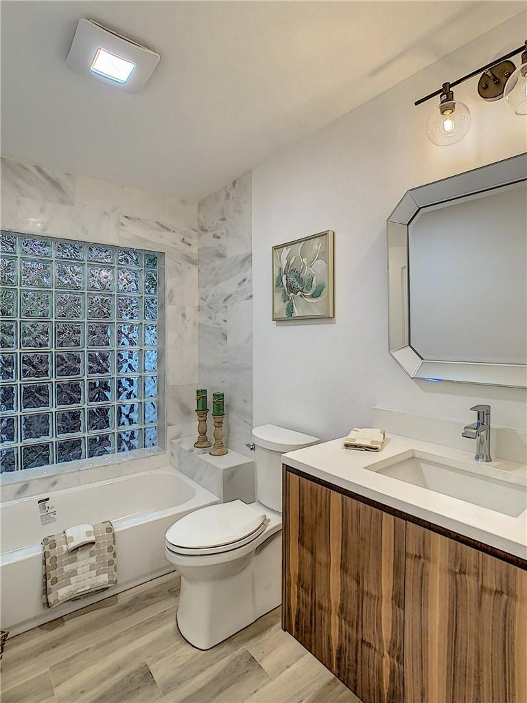 4133 Northwest 28th Way Boca Raton, FL 33434 - Photo 9 of 12 New Second Marble Bath with Floating Custom Vanity