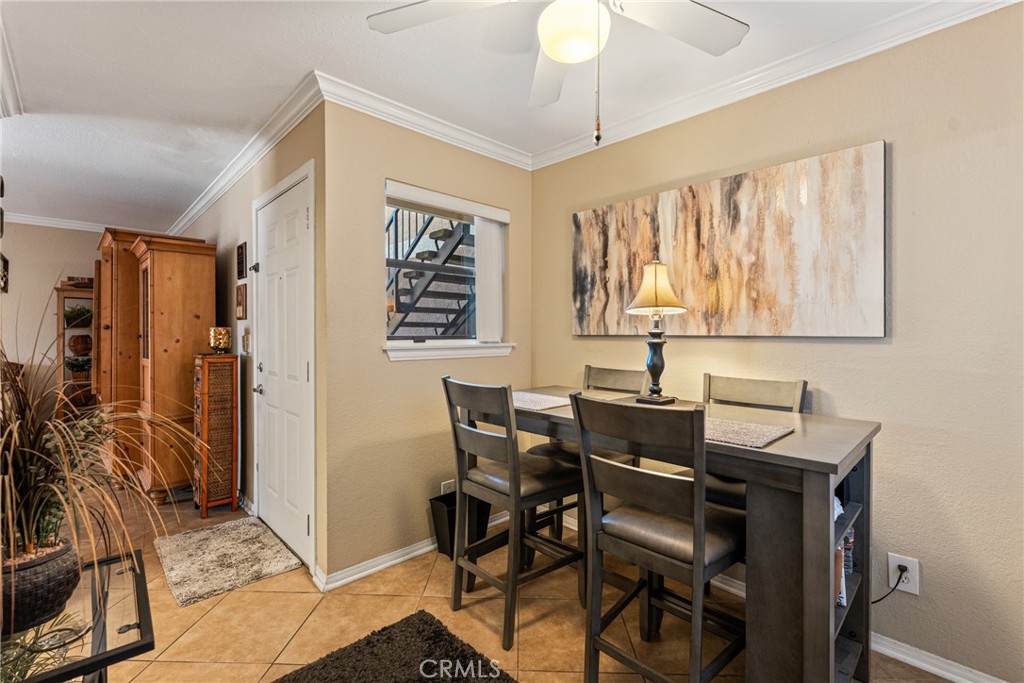 10655 Lemon Avenue Rancho Cucamonga, CA 91737 - Photo 12 of 32 a view of a dining room with furniture and a chandelier