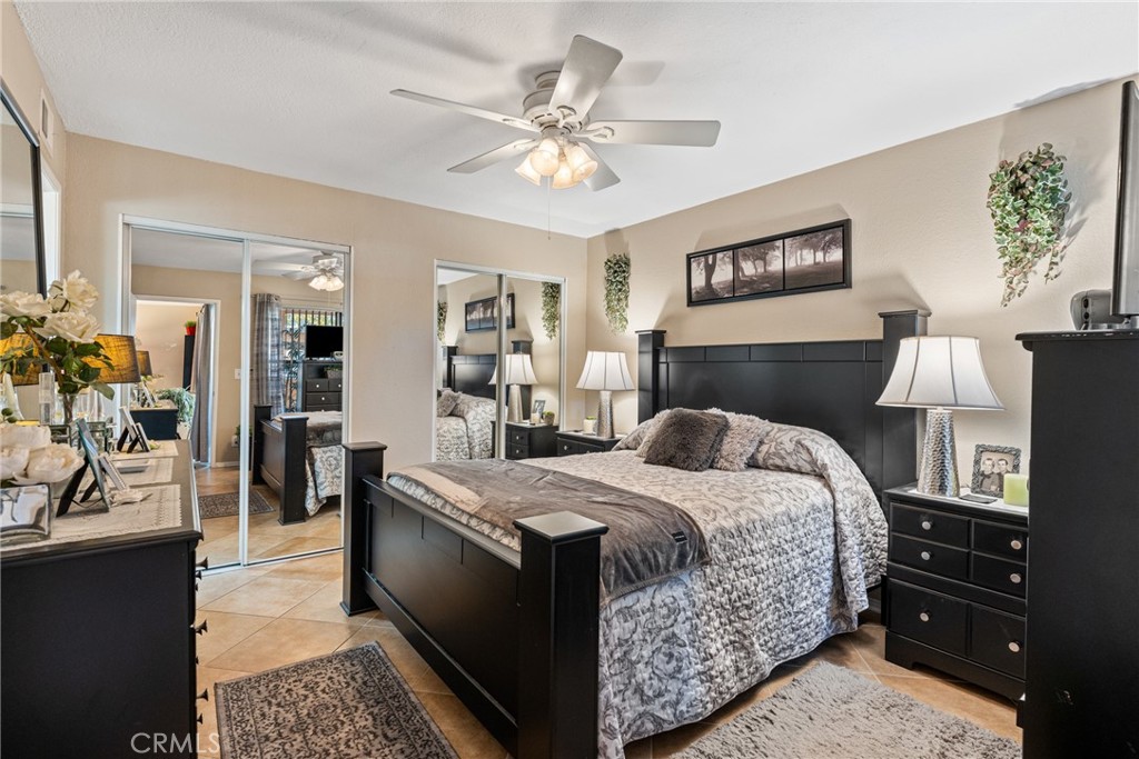 10655 Lemon Avenue Rancho Cucamonga, CA 91737 - Photo 17 of 32 a bedroom with a bed and wooden floor