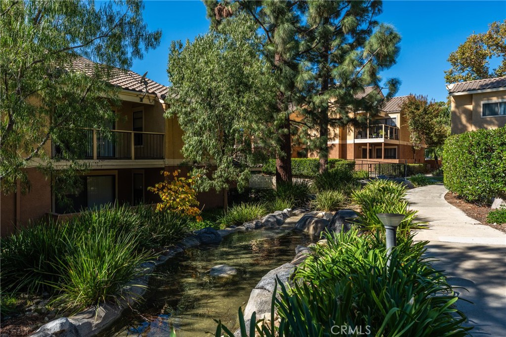 10655 Lemon Avenue Rancho Cucamonga, CA 91737 - Photo 23 of 32 a view of a house with a yard and plants