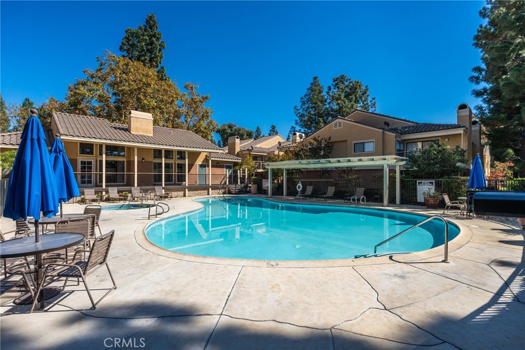 10655 Lemon Avenue Rancho Cucamonga, CA 91737 - Photo 24 of 32 a front view of a house with swimming pool having outdoor seating