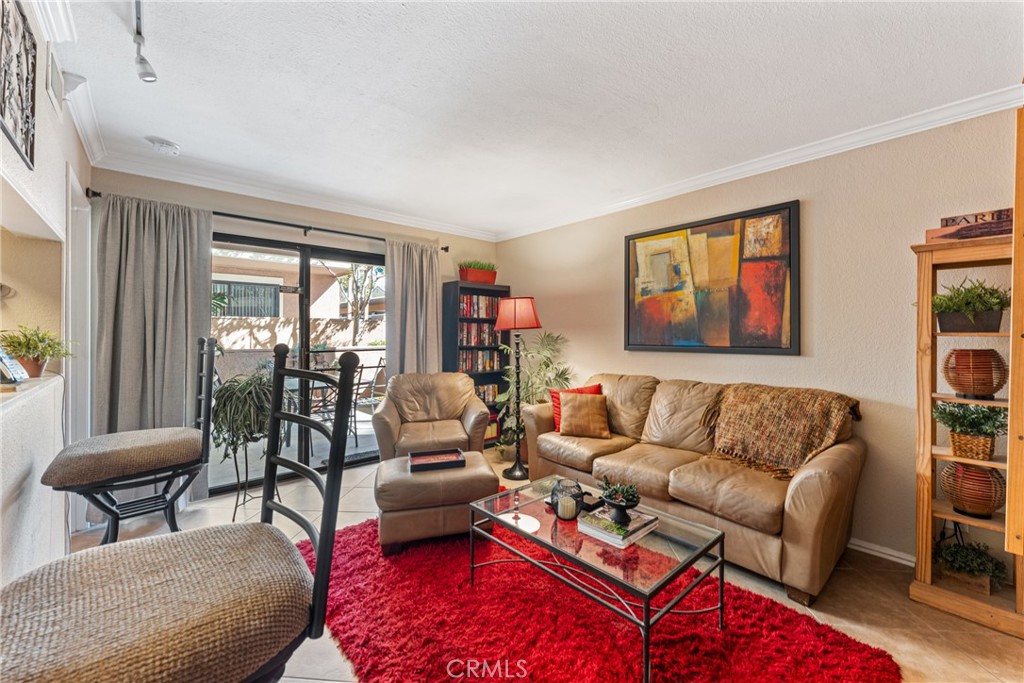 10655 Lemon Avenue Rancho Cucamonga, CA 91737 - Photo 3 of 32 a living room with furniture and a large window