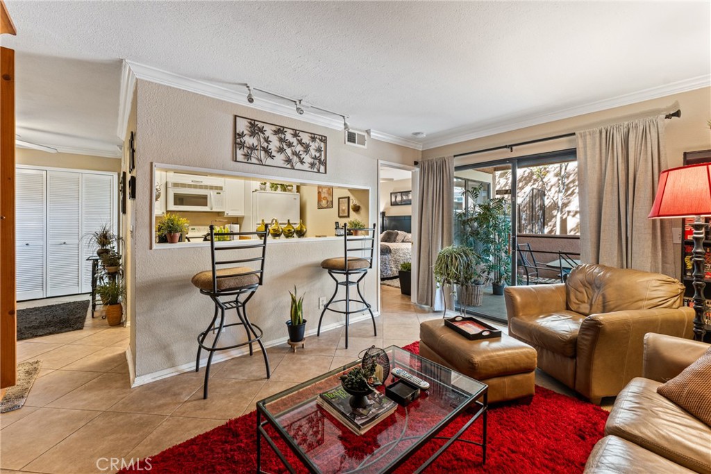 10655 Lemon Avenue Rancho Cucamonga, CA 91737 - Photo 5 of 32 a living room with furniture and large windows