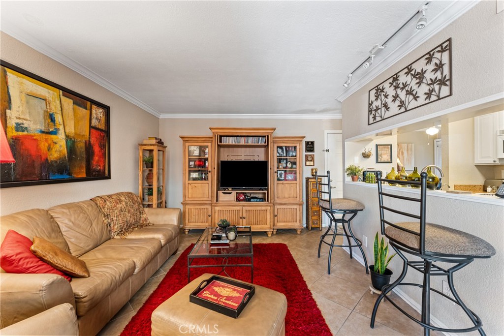 10655 Lemon Avenue Rancho Cucamonga, CA 91737 - Photo 6 of 32 a living room with furniture and a flat screen tv