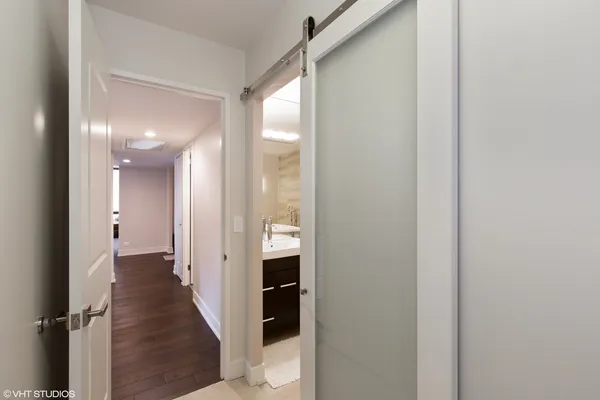 a bed room with a bed and a chair