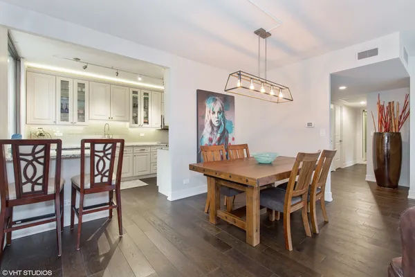 a kitchen with granite countertop a sink stainless steel appliances and cabinets