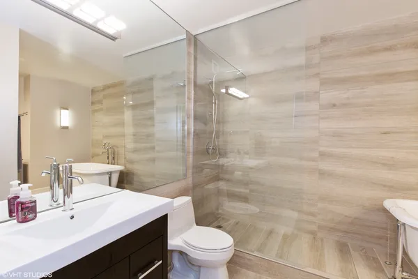 a bathroom with a bathtub and a sink