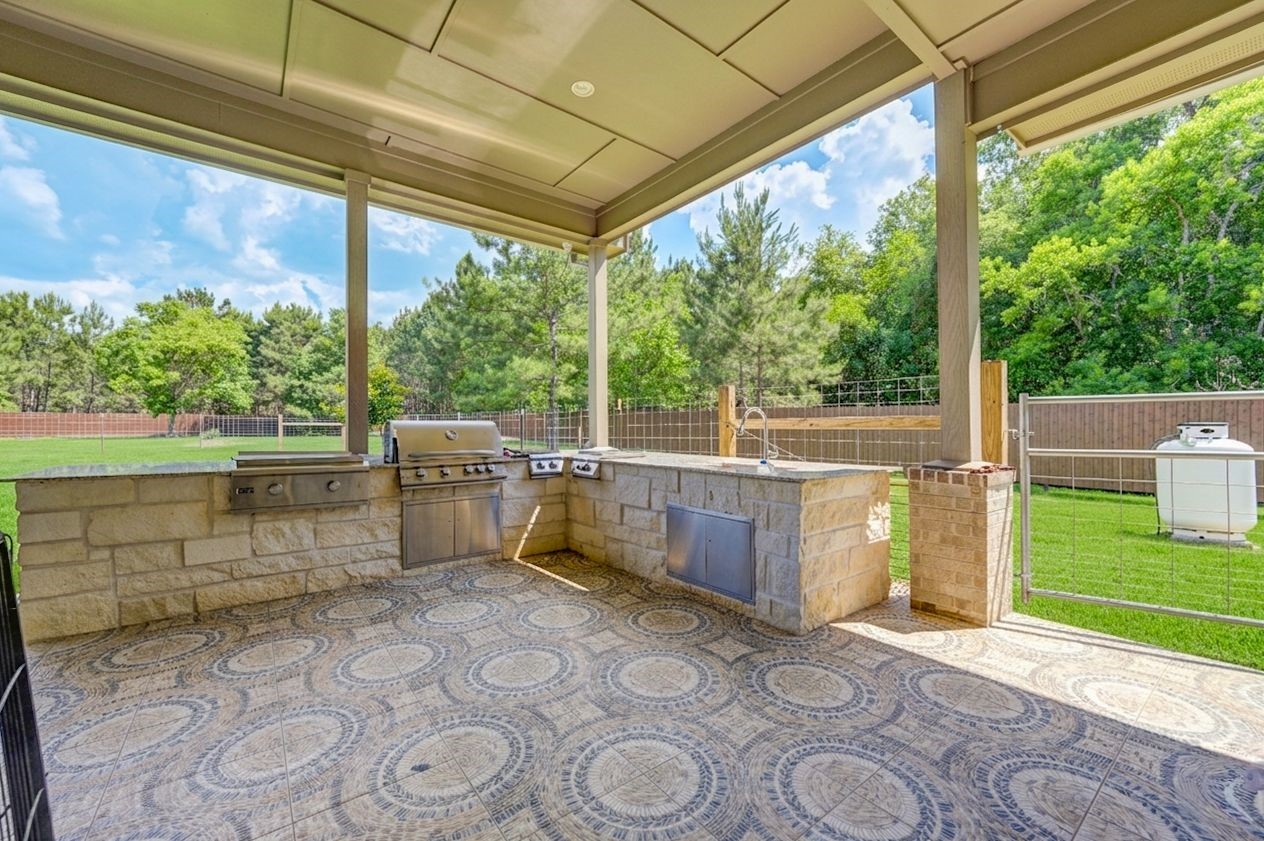 21038 Angus Drive Cleveland, TX 77328 - Photo 42 of 49 a view of a porch with furniture and a yard