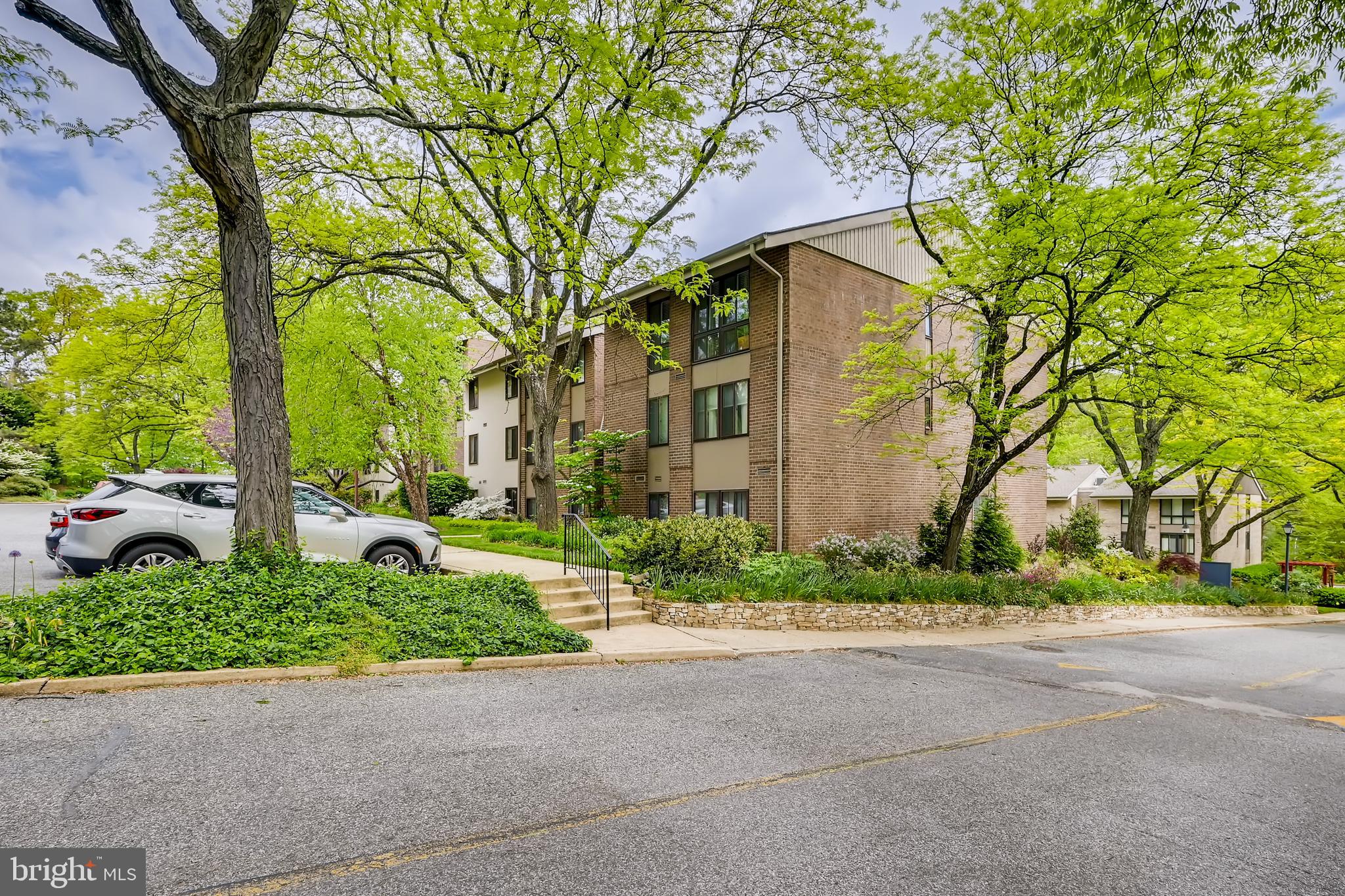 112 Cross Keys Road, Unit R112D Baltimore, MD 21210 - Photo 2 of 17 exterior - mid level - with l garage parking space