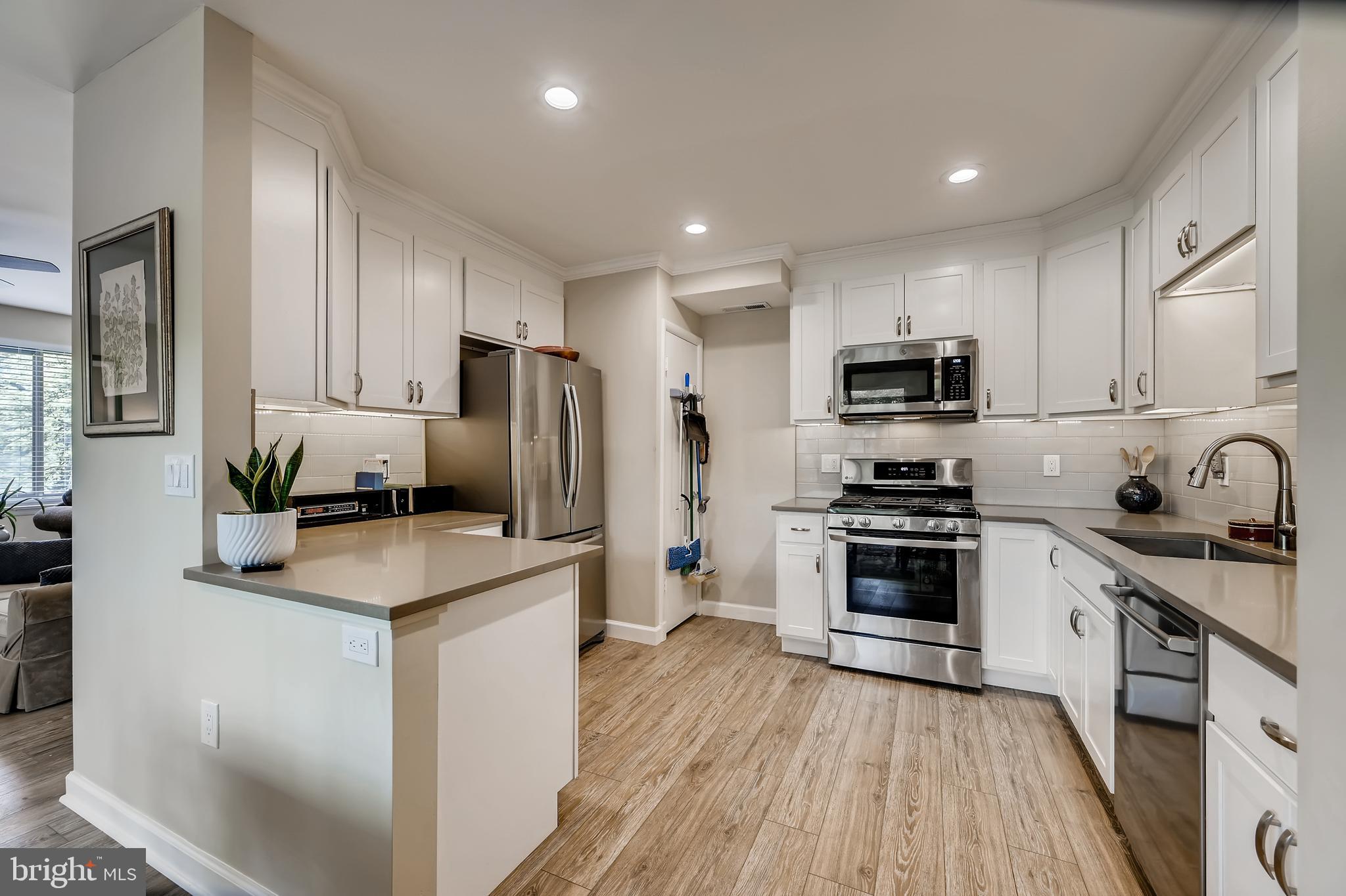 112 Cross Keys Road, Unit R112D Baltimore, MD 21210 - Photo 7 of 17 NEW and sparkling kitchen with stainless steel