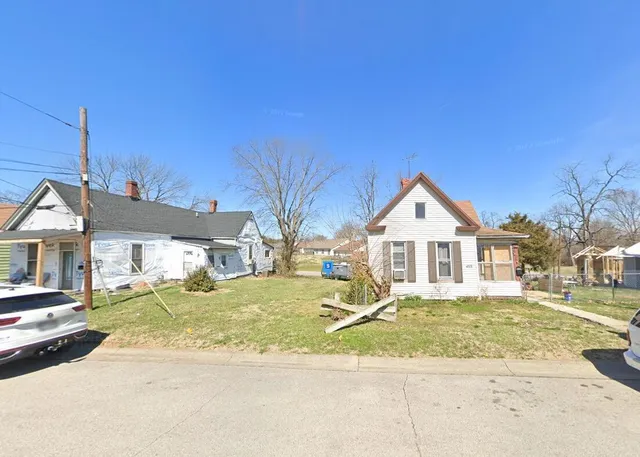 an aerial view of a house with a garden