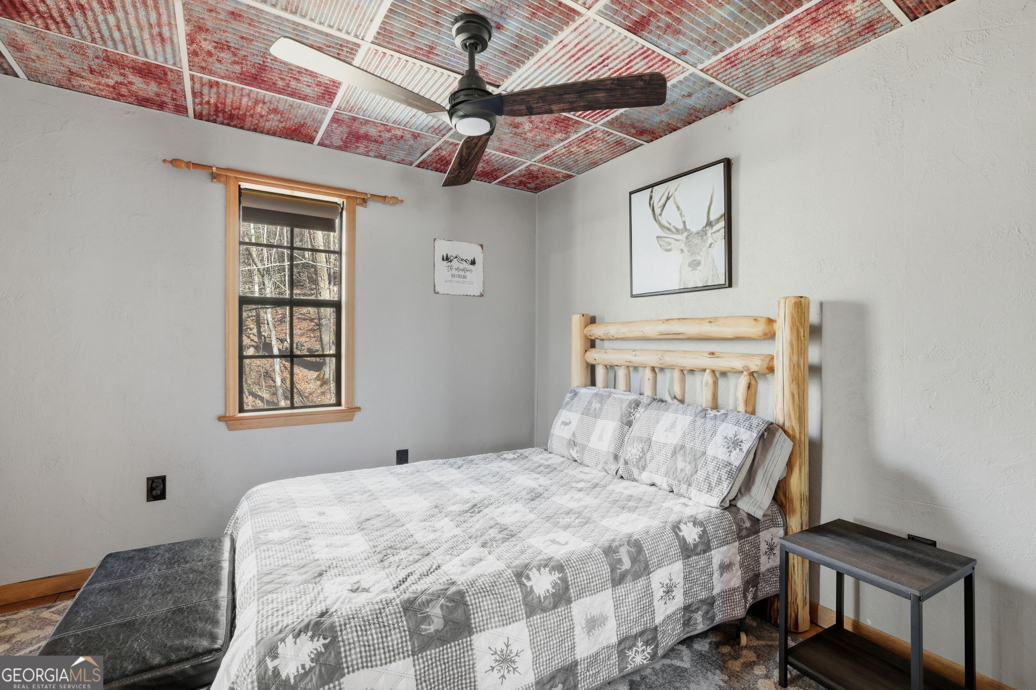 355 Henslee Hollow Lane Rabun Gap, GA 30568 - Photo 11 of 47 a bedroom with a bed and a window