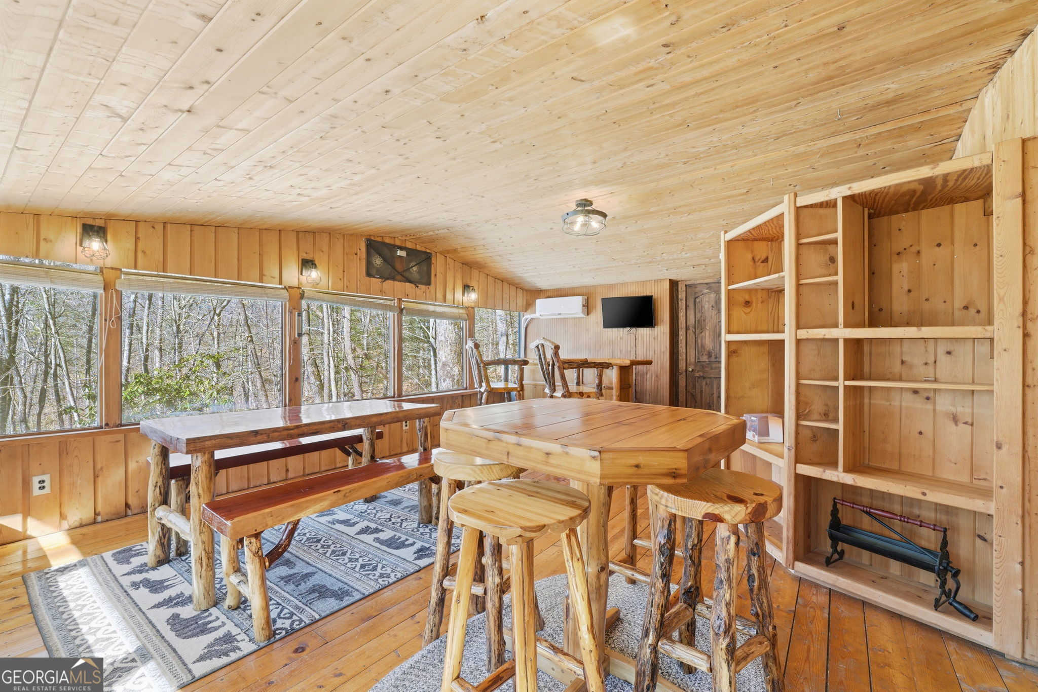 355 Henslee Hollow Lane Rabun Gap, GA 30568 - Photo 13 of 47 a view of a dining room with furniture window and outside view