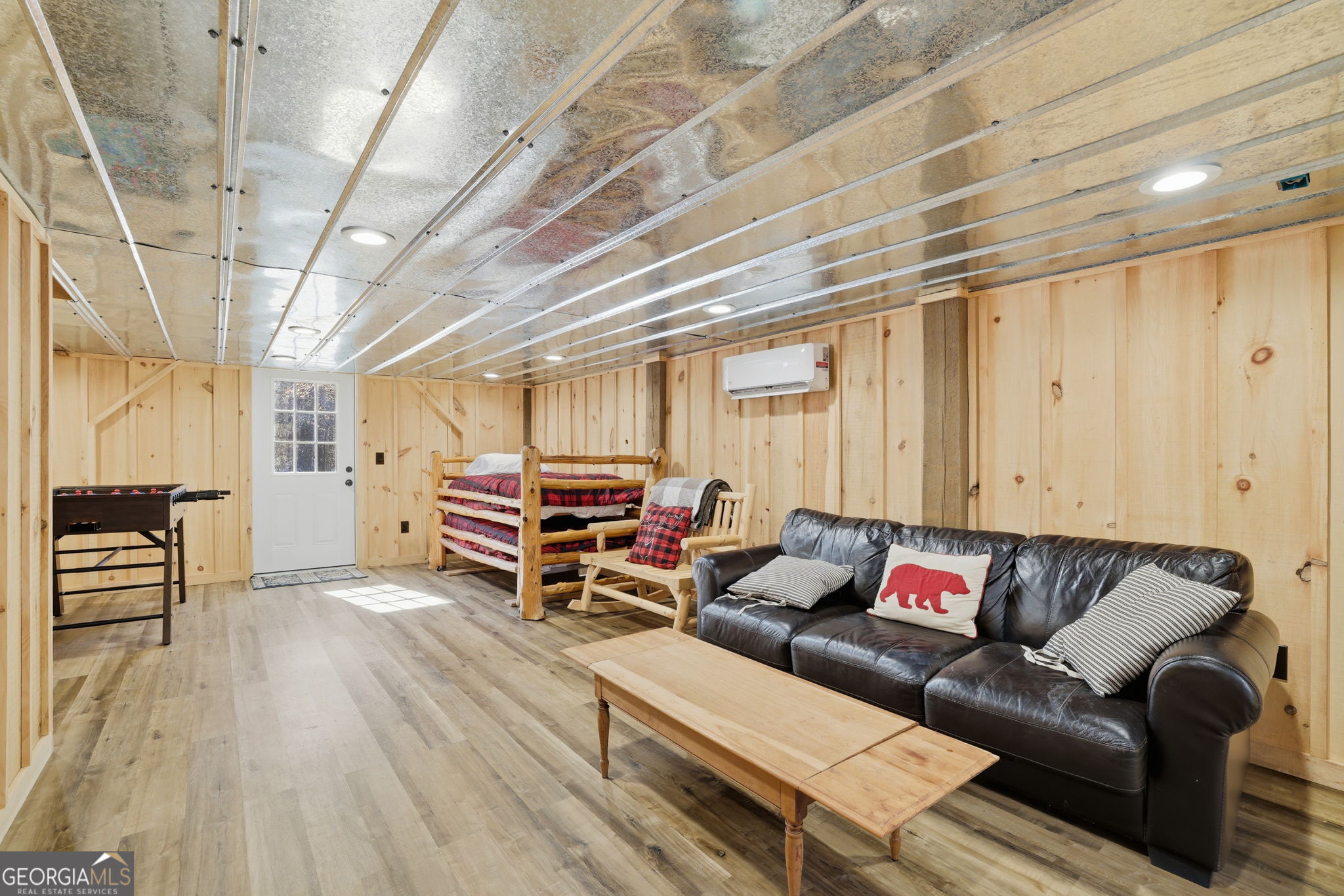 355 Henslee Hollow Lane Rabun Gap, GA 30568 - Photo 20 of 47 a living room with furniture and a wooden floor