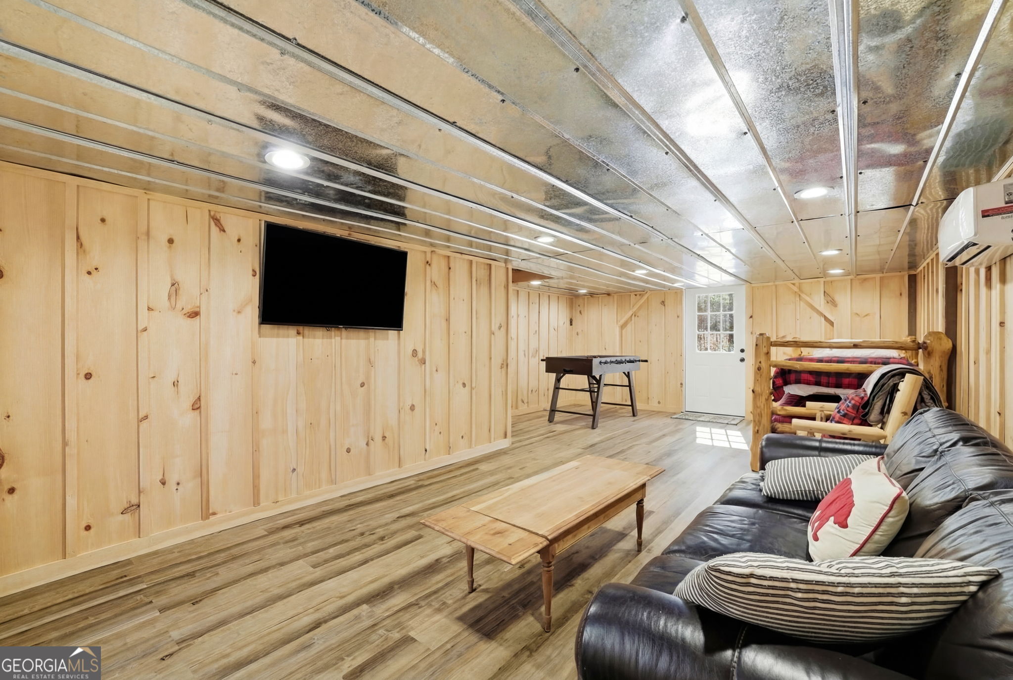 355 Henslee Hollow Lane Rabun Gap, GA 30568 - Photo 22 of 47 a living room with furniture and a flat screen tv