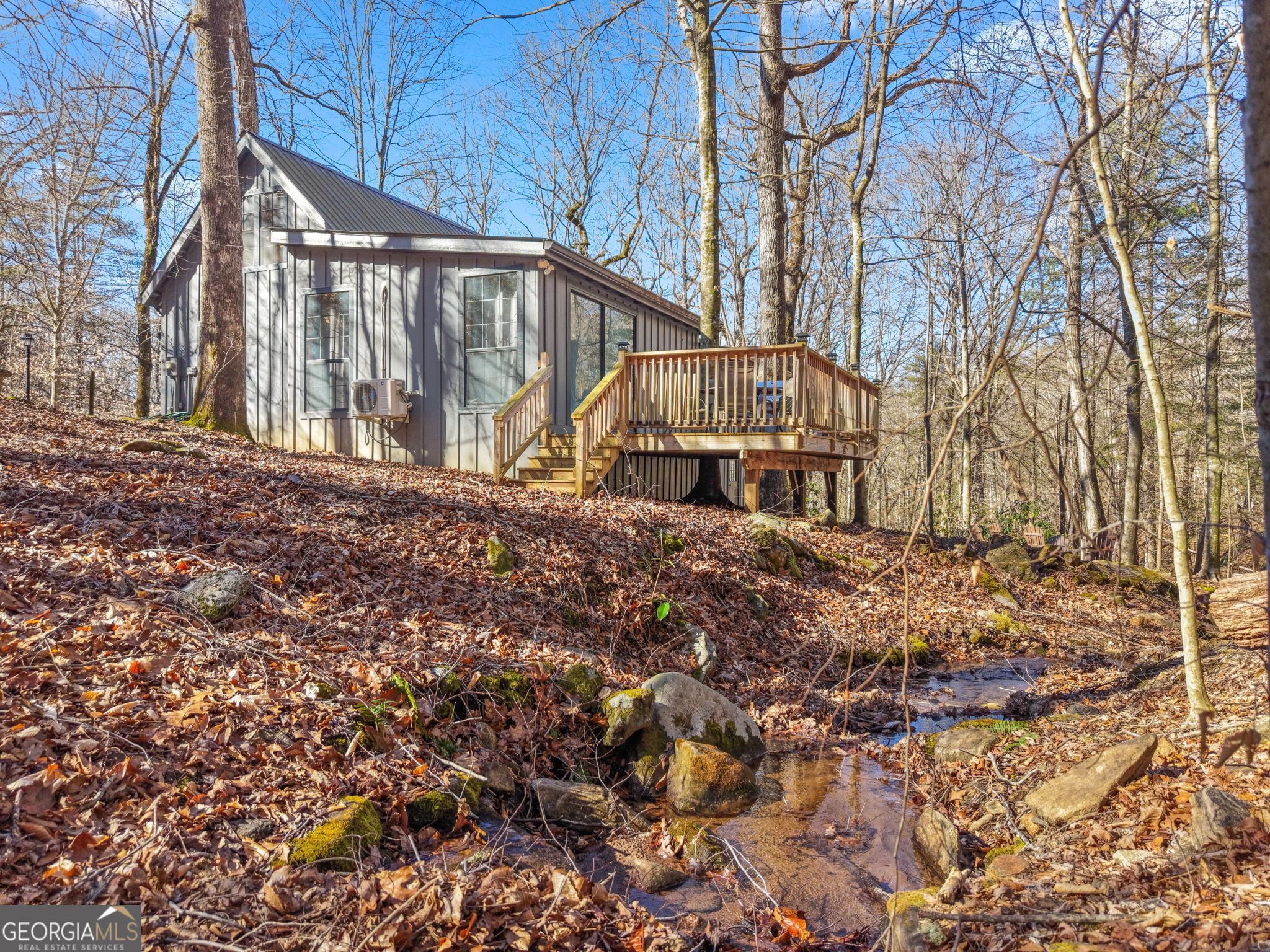 355 Henslee Hollow Lane Rabun Gap, GA 30568 - Photo 28 of 47 a view of wooden house with a dry yard