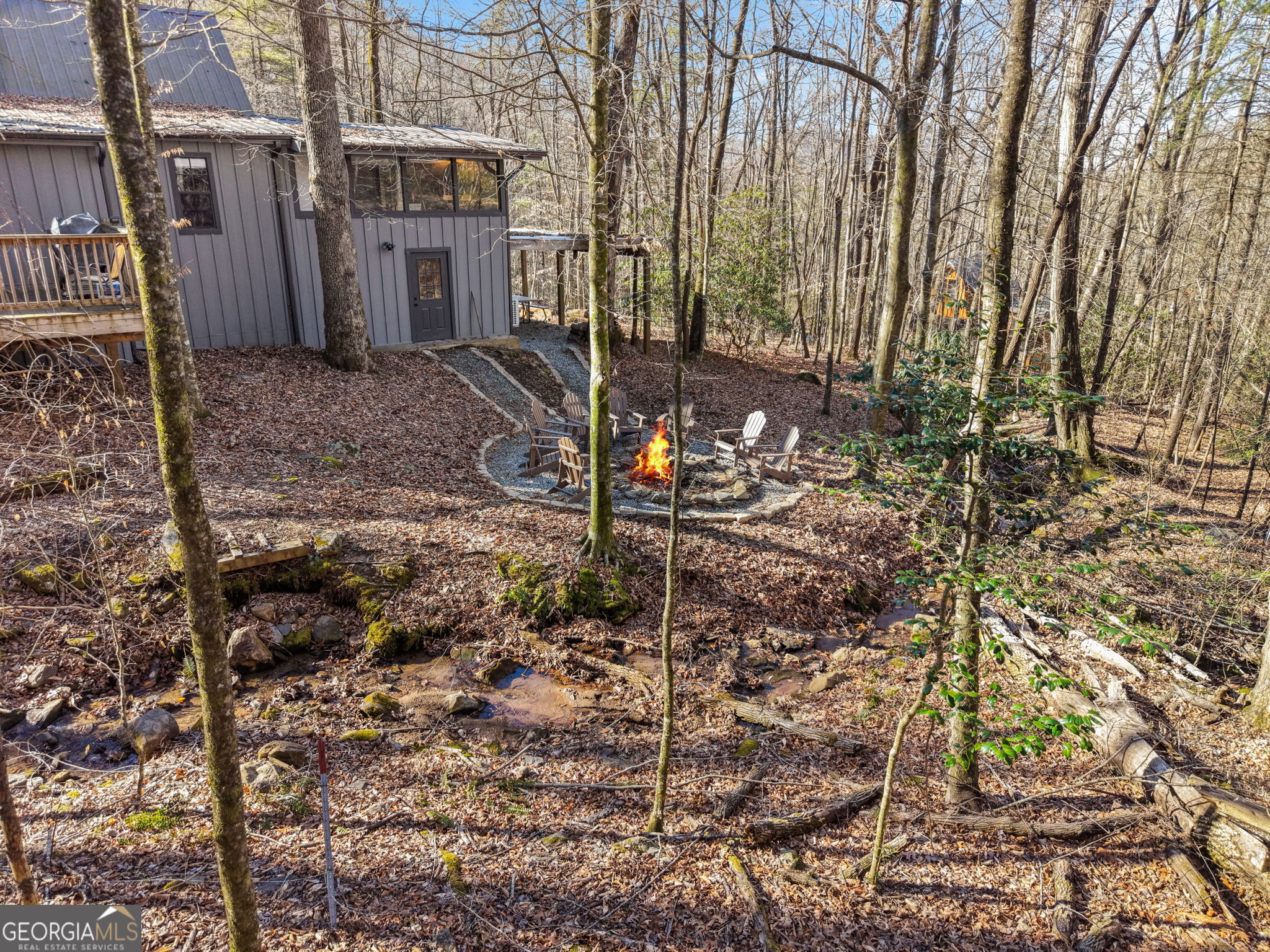 355 Henslee Hollow Lane Rabun Gap, GA 30568 - Photo 32 of 47 a backyard of a house with lots of green space