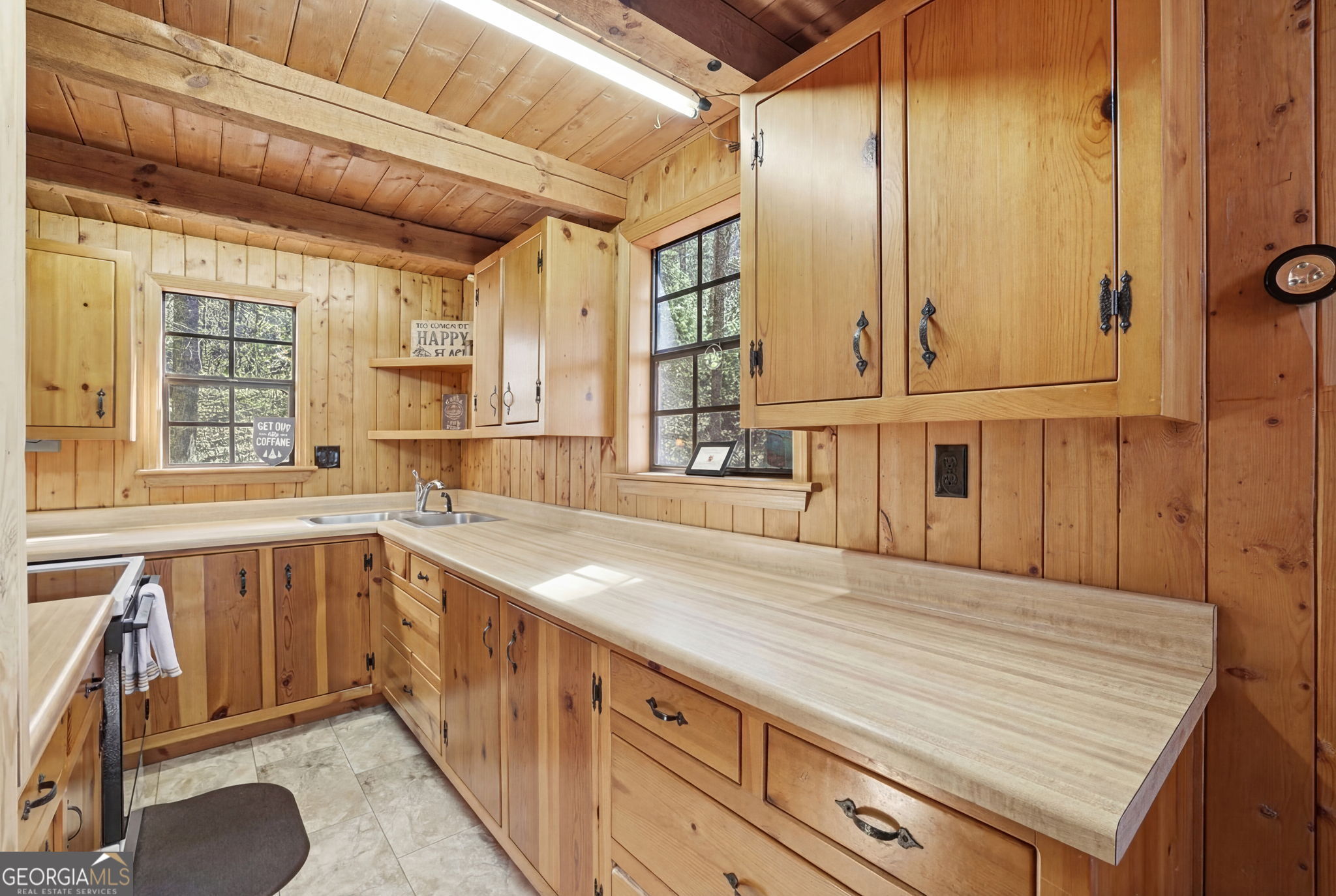 355 Henslee Hollow Lane Rabun Gap, GA 30568 - Photo 6 of 47 a kitchen with a sink and cabinets