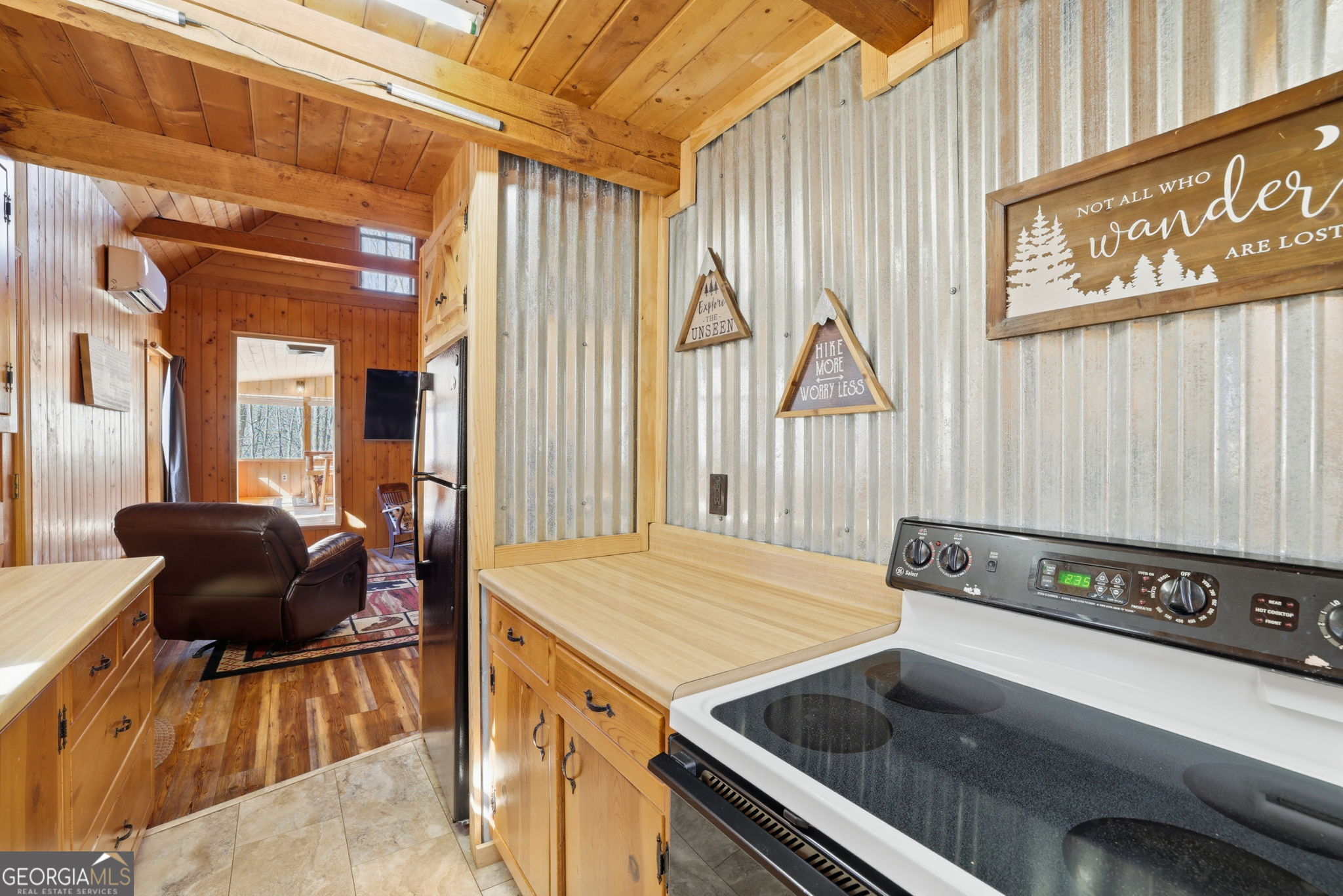 355 Henslee Hollow Lane Rabun Gap, GA 30568 - Photo 7 of 47 a living room with a couch and a table