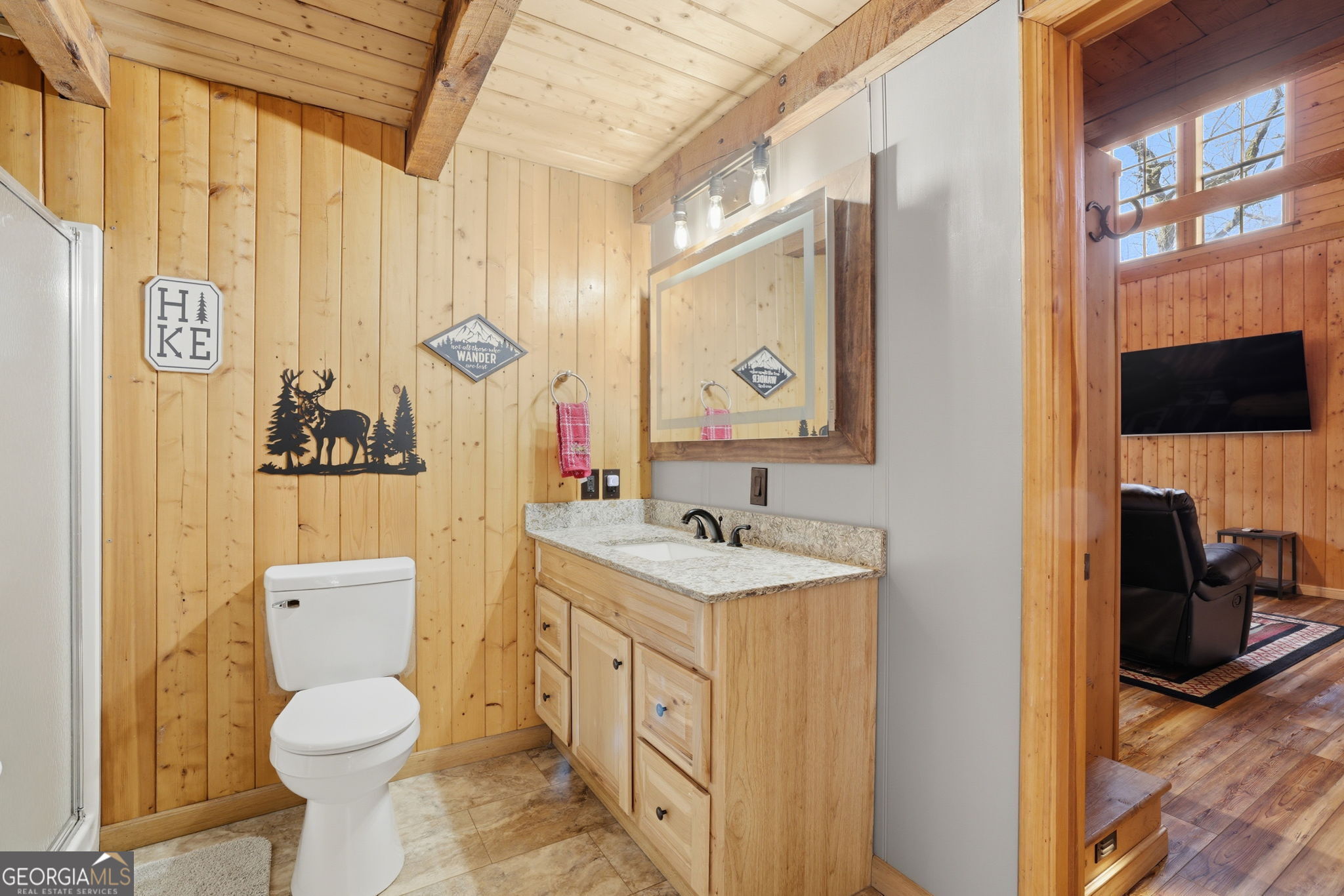 355 Henslee Hollow Lane Rabun Gap, GA 30568 - Photo 10 of 47 a bathroom with a toilet sink and mirror