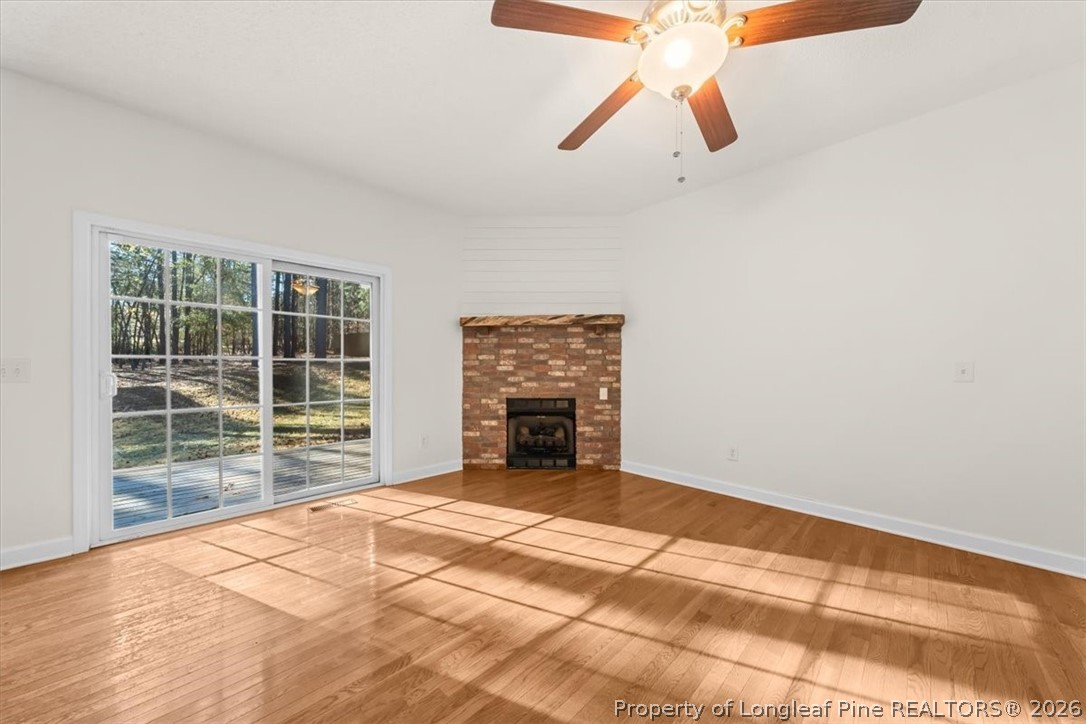 60 Spring Lake Drive Pinehurst, NC 28374 - Photo 5 of 42 a view of an empty room with window and chandelier fan